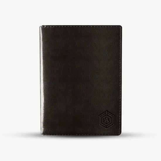 Smartphone Displaying Arista Tracker App Connected to Brown Smart Passport Holder for Location
