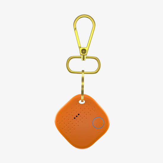 Active Person Using Orange Smart Keychain with Tracking Technology in Outdoor Setting