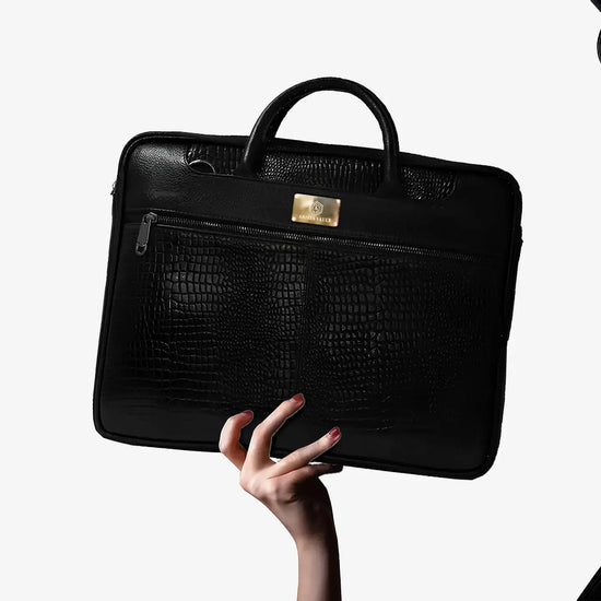 Executive Using Black Croc Textured Leather Bag with Fingerprint Security During Business Travel