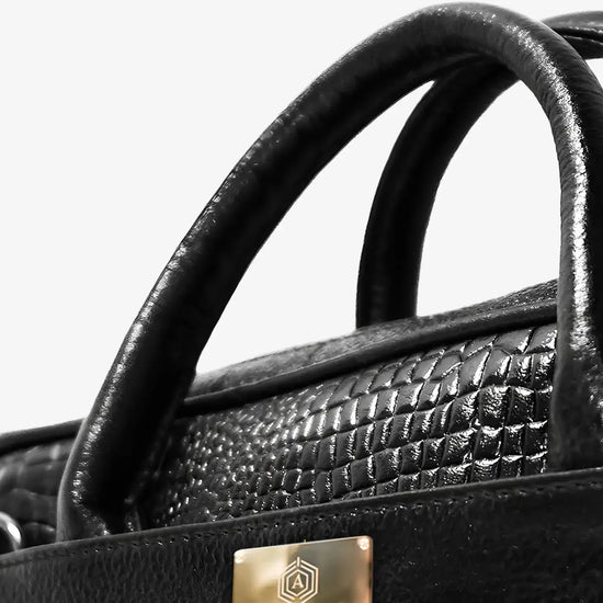 Executive Using Black Croc Textured Leather Bag with Fingerprint Security During Business Travel