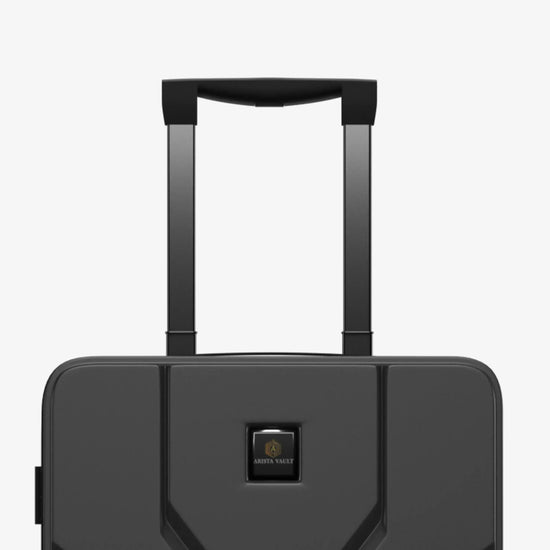 Person Riding Grey Jarviz Smart Luggage in Airport Terminal Demonstrating Mobility Feature