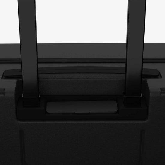 Person Riding Grey Jarviz Smart Luggage in Airport Terminal Demonstrating Mobility Feature