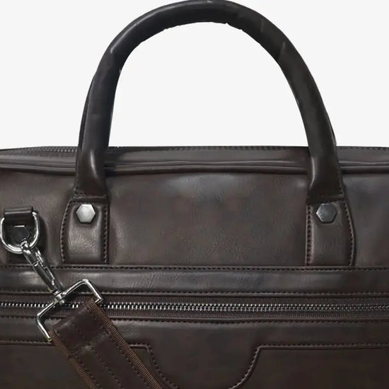 Business Traveler Using Brown ZenMatte Laptop Bag with Fingerprint Security at Airport